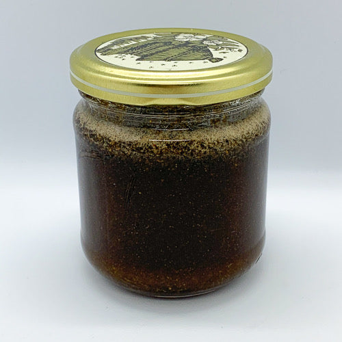 Pot de miel naturel d'Euphorbe Daghemous avec texture dorée

